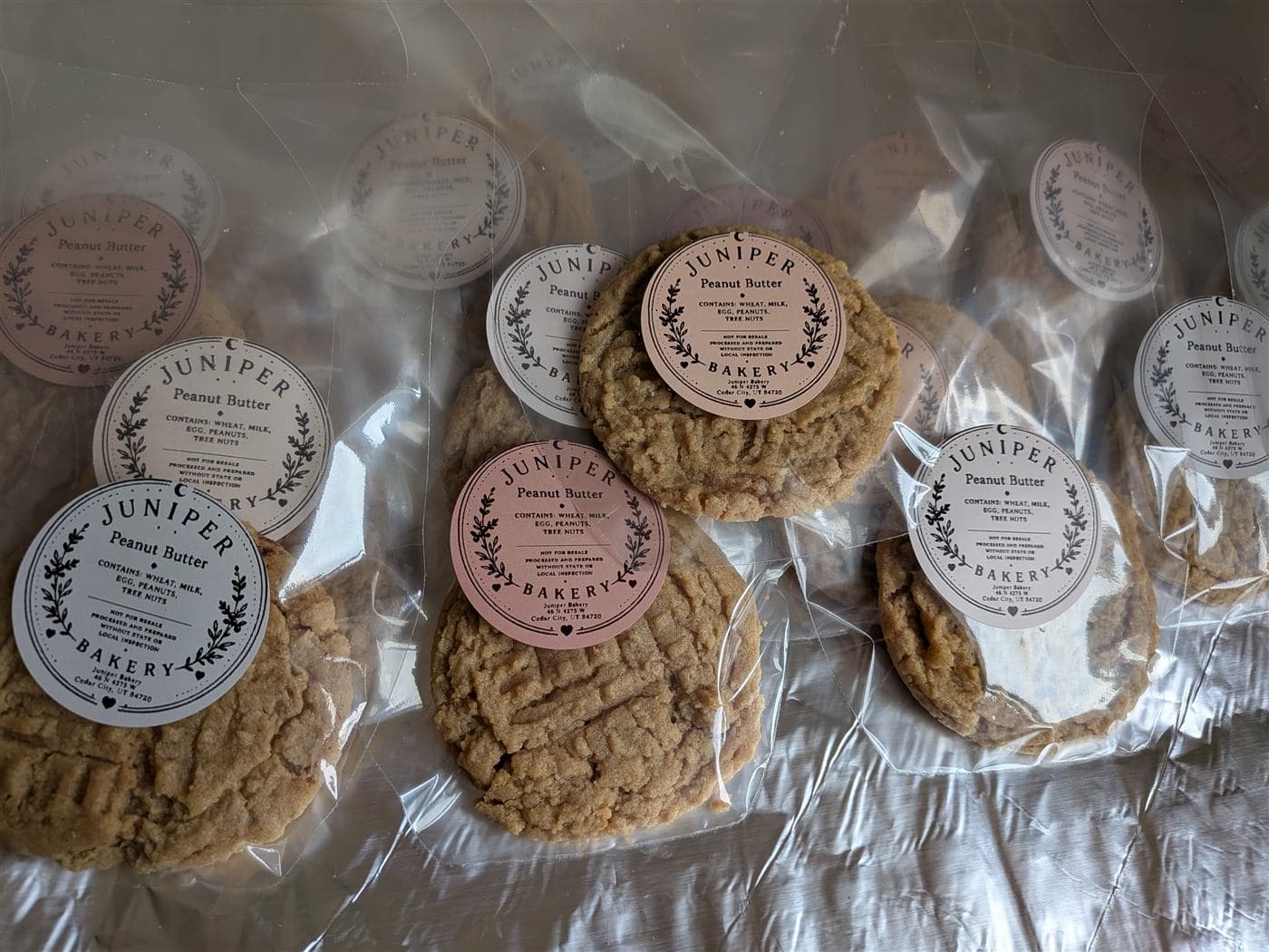 Peanut butter cookies in clear bakery bags