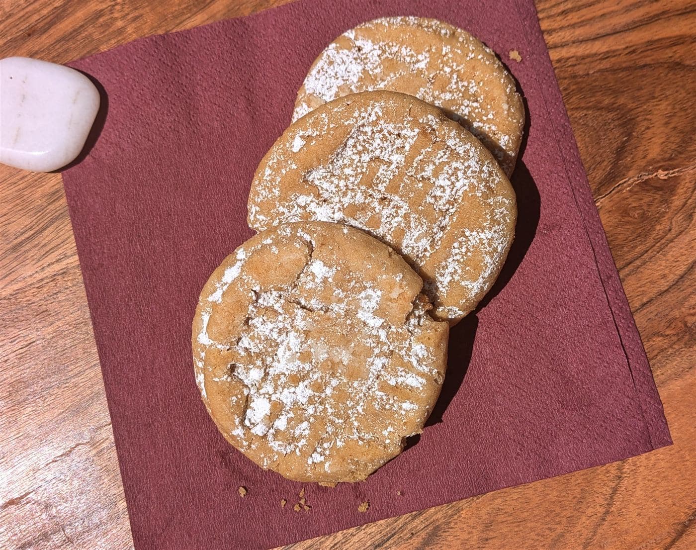 Peanut butter cookies on a burgundy napkin