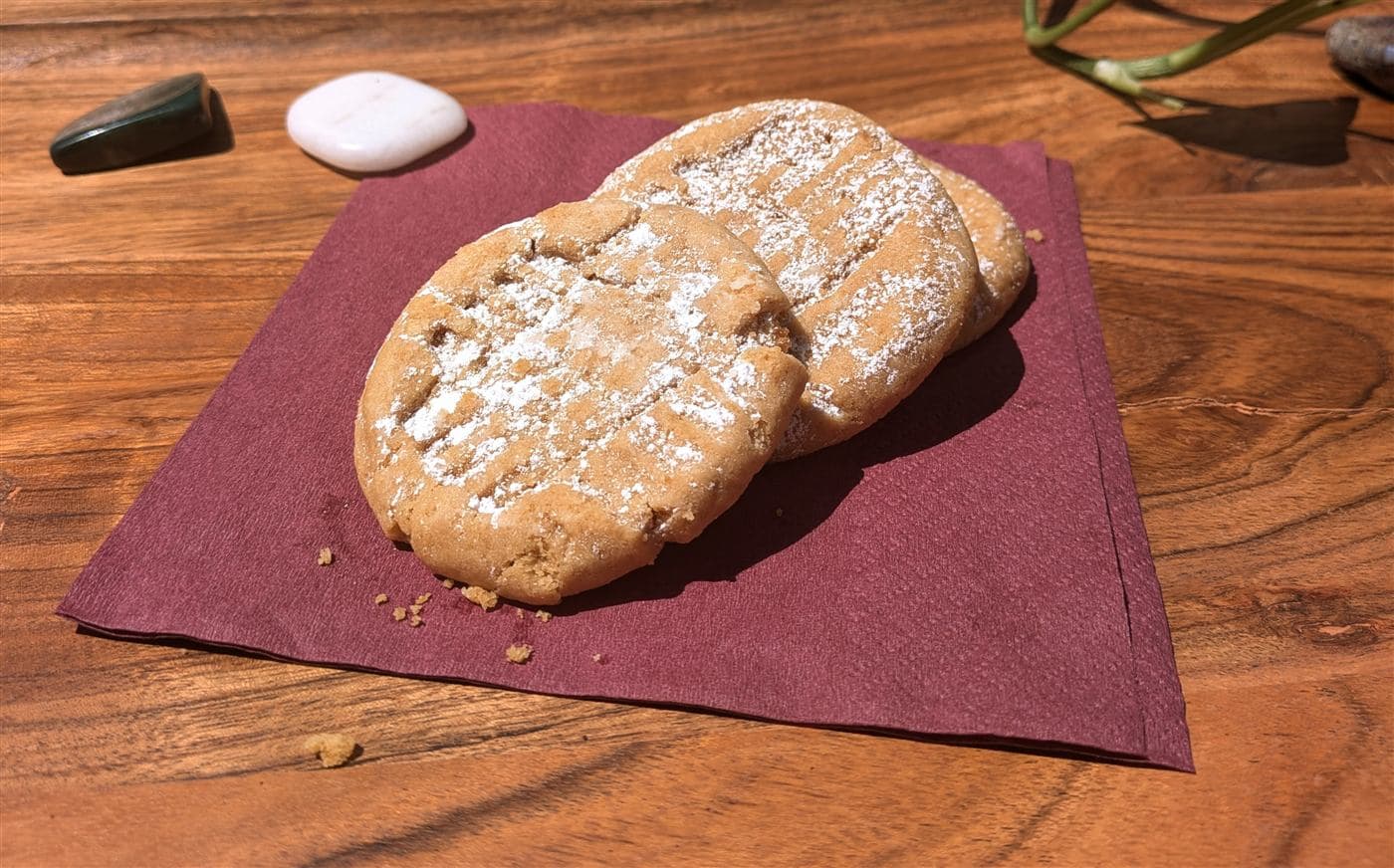 Peanut butter cookies arranged on a wooden table