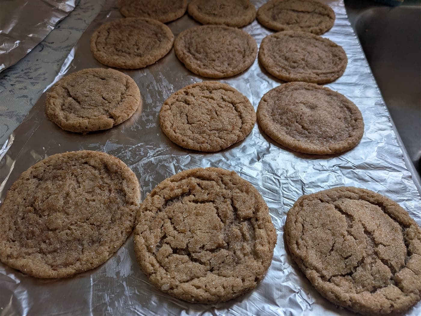 Freshly baked snickerdoodles on foil